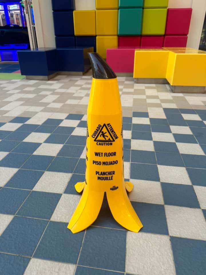 Banana shaped wet floor signs on a cruise