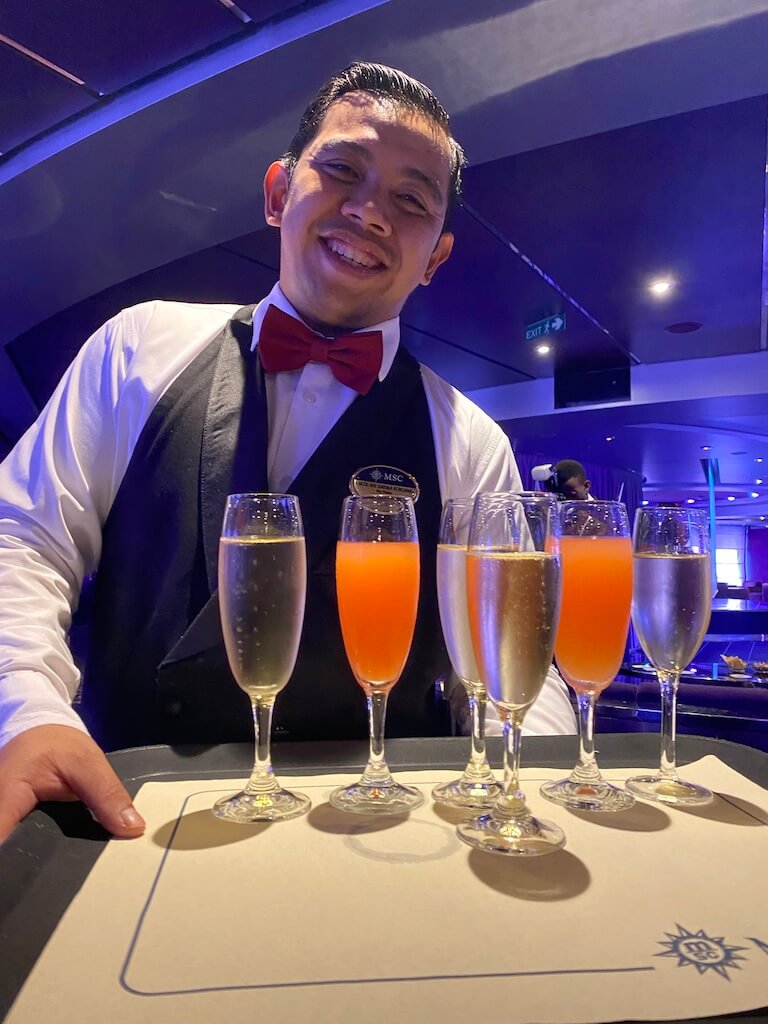 Waiter serving drinks on a cruise