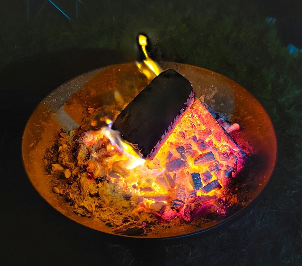 Campfire in fire pit at night